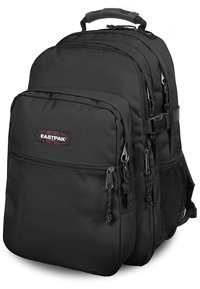 Mochila Eastpak negra hecha de un tejido duradero, con múltiples compartimentos con cremallera, correas ajustables y un bolsillo lateral de malla.