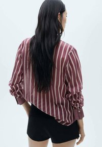Mango Bluza s gumbima - red