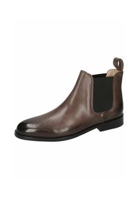 Botín Chelsea de cuero marrón con textura suave, paneles laterales elásticos y una lengüeta, con puntera redondeada y tacón bajo negro.