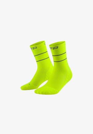 Neon yellow athletic socks with ribbed cuffs, featuring two horizontal black stripes and a logo at the top. Made from lightweight, breathable material.
