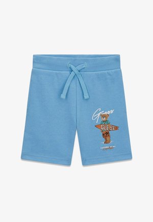 Pantaloncini azzurri per bambini con vita a coulisse e grafica di un orso che tiene una tavola da surf con la scritta "Guess" sulla gamba destra.