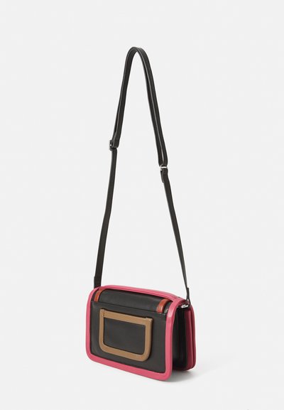 Handbag featuring a rectangular shape with a black base, pink edges, and a tan front pocket. Adjustable black strap and smooth leather texture.
