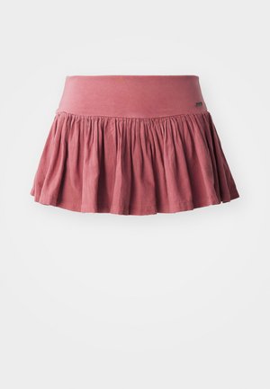 Jupe en coton rose avec une taille élastique, présentant des détails froncés et une forme évasée. Texture lisse, design mi-jupe.