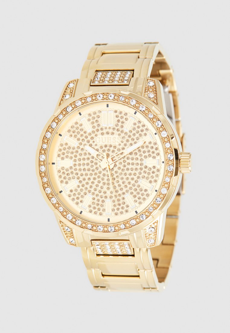 Reloj dorado con una esfera texturizada y acentos de cristal, correa de acero inoxidable y un bisel adornado con piedras brillantes.