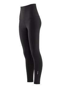 Höga svarta leggings i stretchigt material. Har en sömlös design och en liten logotyp nära ankeln för detalj.