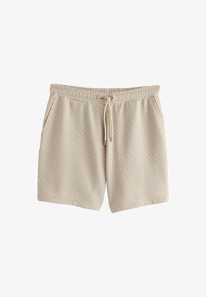 Pantaloni corti beige con motivo a spina di pesce, vita elastica con cordino, tasche laterali, realizzati in tessuto testurizzato.
