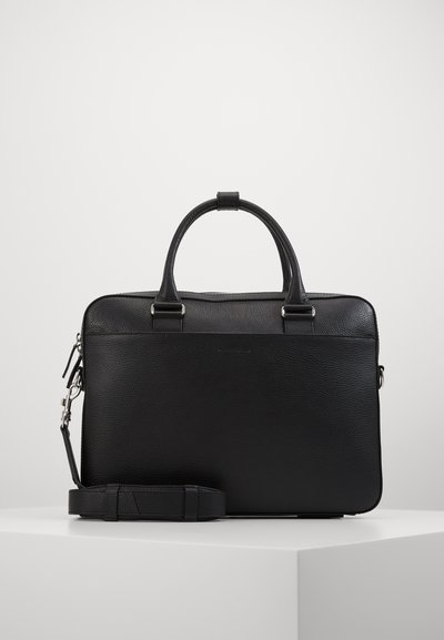 Black leather briefcase with textured finish, dual handles, detachable shoulder strap, and metal hardware. Zipper closure at the top.