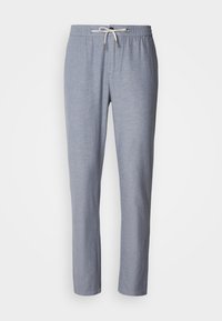 Γκρι, ελαφρύ παντελόνι από ύφασμα με ελαστική μέση, κλείσιμο με κορδόνι και κωνικά μπατζάκια. Λείο ύφασμα, χωρίς ορατά σχέδια.