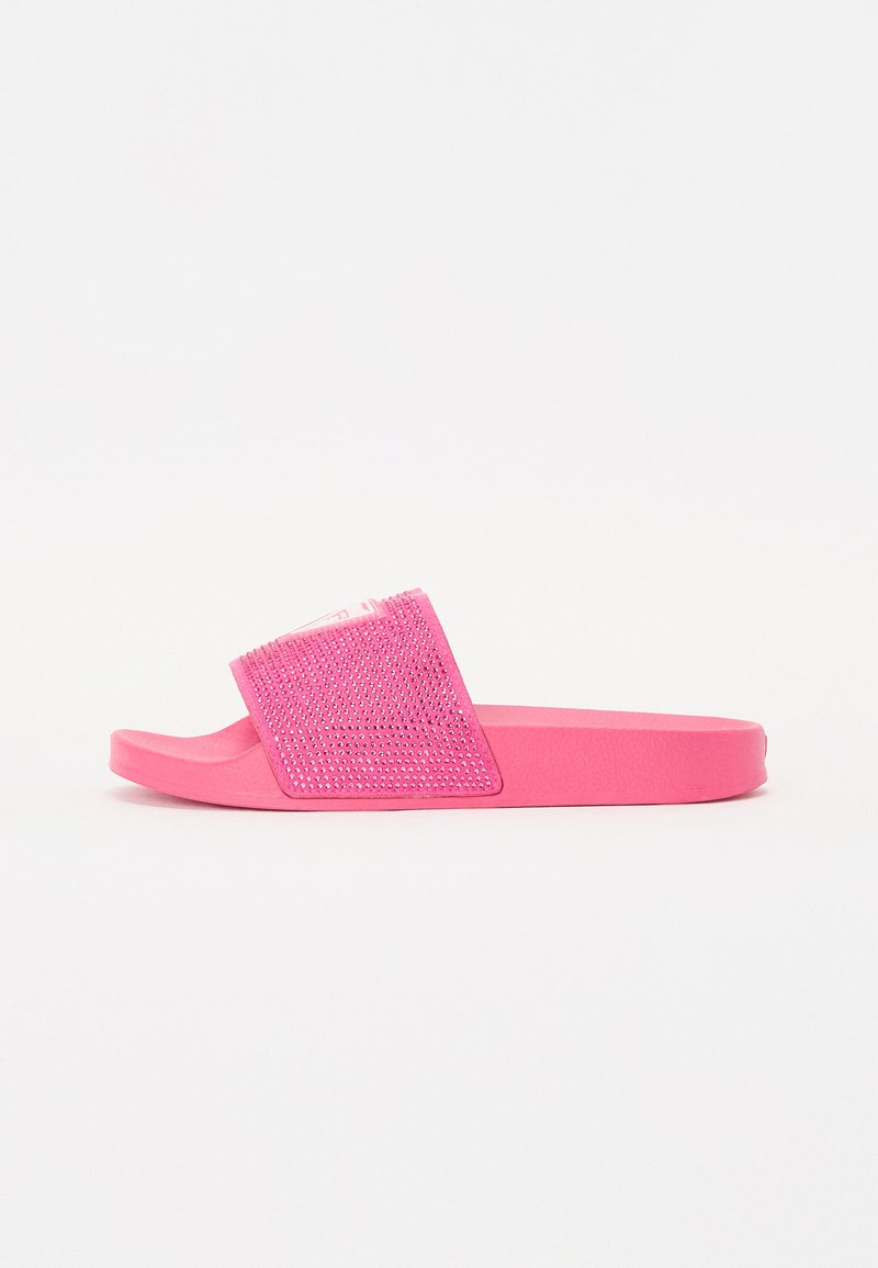 Pink slide sandals with a textured, rhinestone-embellished upper and flat rubber sole. The overall shape is open-toed with a wide strap.
