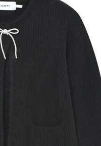 Black knitted cardigan with a textured pattern, featuring a silver drawstring closure and front pockets.