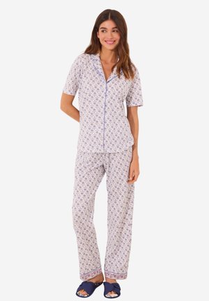 Short-sleeve, button-up pajama set in light purple with intricate floral pattern; matching pants with an elastic waistband and trim detail.