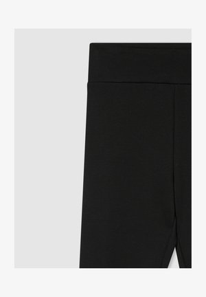 Leggings neri con una cintura ampia, realizzati in un tessuto liscio e elastico con un finish uniforme e senza motivi o dettagli visibili.