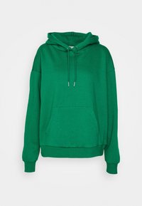 Sweat-shirt vert avec capuche, manches longues et une poche kangourou à l'avant. Confectionné dans un tissu doux et texturé, avec des cordons de serrage et des poignets côtelés.
