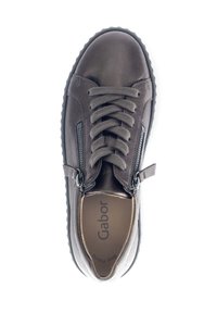 Brown leather sneaker featuring laces, side zippers, and a textured rubber sole. The interior shows the brand name “Gabor” printed on the insole.