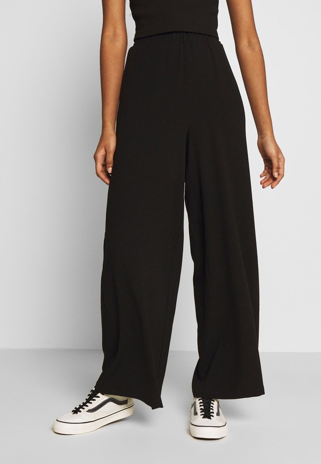 BELL TROUSERS - Pantaloni - black