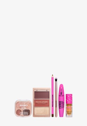 Six produits de maquillage Revolution Beauty London aux tons roses et neutres, disposés en ligne sur un fond blanc.