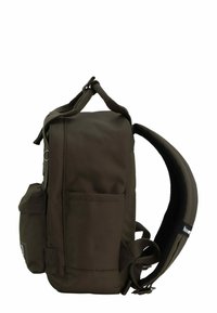 Brown canvas backpack with padded straps, side pocket, top handle, and texture detailing. Minimalist rectangular design.