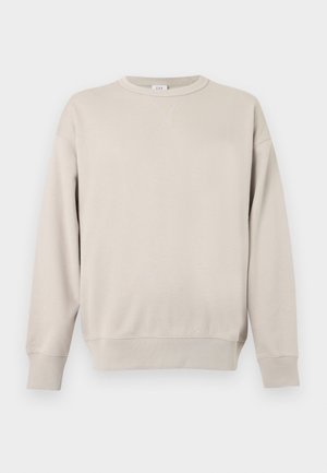 Beige crewneck-sweatshirt med lange ærmer, ribbede manchetter og kant samt en lille syning i trekantsform under halsudskæringen.