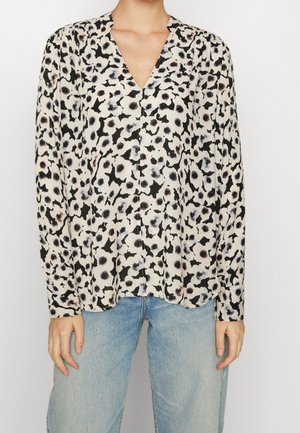 Blusa a maniche lunghe in tessuto leggero con base crema, caratterizzata da una stampa astratta in nero e grigio, scollatura a V e vestibilità rilassata.