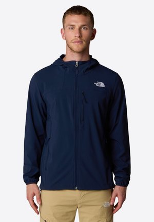 Marineblaue Outdoor-Jacke mit Kapuze, Reißverschlusstaschen und Logo-Akzent auf der Brust. Leicht, glatte текстура, taillierte Passform.