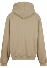 Felpa con cappuccio beige, in materiale misto cotone, presenta una finitura texurizzata, polsini e orlo a coste, con un dettaglio sulla cucitura posteriore.