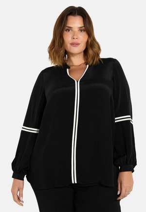 Blusa nera a maniche lunghe in tessuto leggero, con dettagli a strisce bianche sulle maniche e sulla placca centrale, con una vestibilità comoda e scollatura a V.