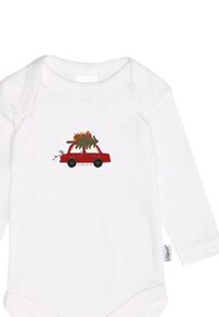 White long-sleeve onesie featuring a red cartoon car with a Christmas tree and colorful ribbons on top, with text “Joy, Peace and Love” below.