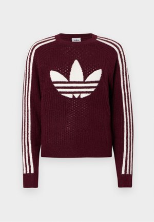 Bordo kootud sviiter valge Adidas trefoil logoga rinnal ja kolm valget triipu, mis jooksevad iga varruka all.
