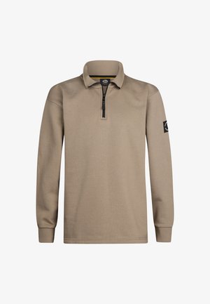 Grauer Langarm-Zip-Hoodie mit hohem Kragen, ausgestattet mit einem kontrastierenden Reißverschluss und gerippten Bündchen, kombiniert mit hellgrauen Jeans und weißen Sneakers.