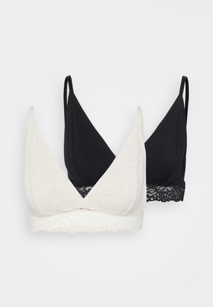 Two bralettes: one cream, one black. Both have a soft, stretchy fabric with a v-neck design. The cream has a lace trim, the black features lace at the bottom.