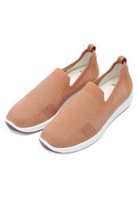 Textured slip-on shoes in light brown with elastic bands, padded insole, and white rubber sole. Casual design with minimal detailing.