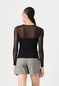 ONLY ONLBECKI BODYTOP - Tops ar garām piedurknēm - black
