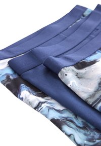 Stretch fabric leggings in dark blue with a marbled blue and black pattern. Features a smooth texture and contrasting waistband design.