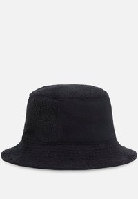 Svart bucket hat i texturerat fleece-material. Har en bred, mjuk skärm och en strukturerad krona med synliga sömmar.