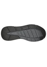 Suola di scarpa in gomma nera con modelli di grip testurizzati, disegni esagonali e indentazioni allungate per aderenza, con bordi lisci.