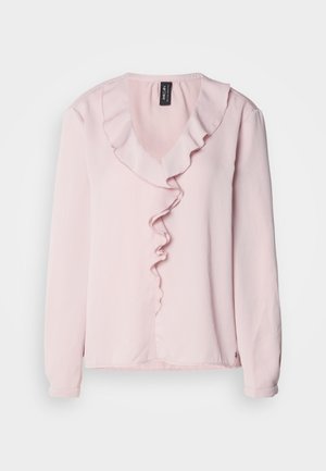 Blouse à manches longues rose clair avec un décolleté en V, ornée d'une ruffle décorative sur le devant. Tissu doux, coupe décontractée.