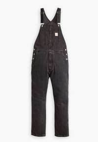 Svarta denimoverall med justerbara remmar, en framficka, silverdetaljer och rak benlook. Mjuk textur med en blekt finish.