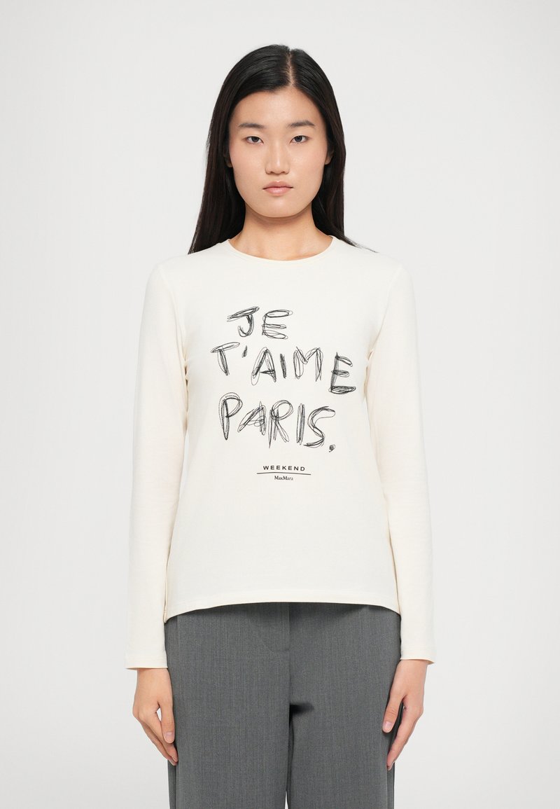 Langemouw, crèmekleurig T-shirt met zwarte opdruk "JE T'AIME PARIS" en een logo aan de onderkant. Zachte stof met een relaxed fit.