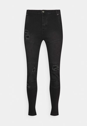 Schwarze Skinny-Jeans mit hoher Taille und abgenutzten Stellen an Oberschenkeln und Knien, mit Knopf- und Reißverschluss.