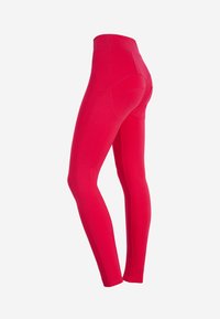 Leggings rojos con una cinturilla alta, hechas de un material elástico. Textura suave sin patrones visibles ni detalles de hardware.