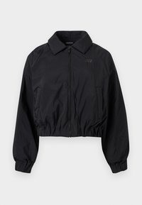 Μαύρο ελαφρύ μπουφάν με φερμουάρ, ελαστικά μανίκια και κάτω μέρος, γιακά με αιχμηρή γραμμή και δύο μπροστινές τσέπες.