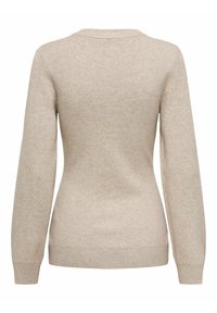Pull beige avec une texture douce, des manches longues et un col rond. Présente des poignets et un ourlet côtelés pour un look ajusté.