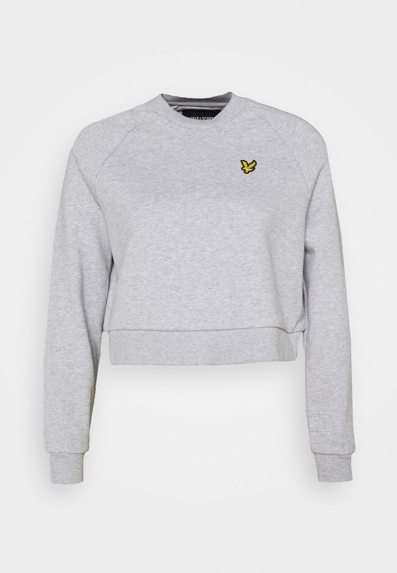 Sweat-shirt court gris clair avec manches longues et petit logo d'oiseau jaune sur la poitrine gauche.