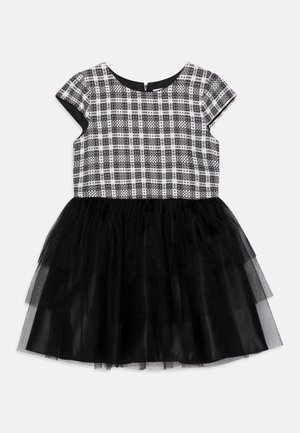 Vestido para niñas con parte superior de manga corta a cuadros en blanco y negro y falda de tul negra en capas, cierre con cremallera en la espalda.