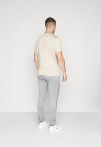 Ellesse SOPRANZI PANT - Donji dijelovi trenirke - grey