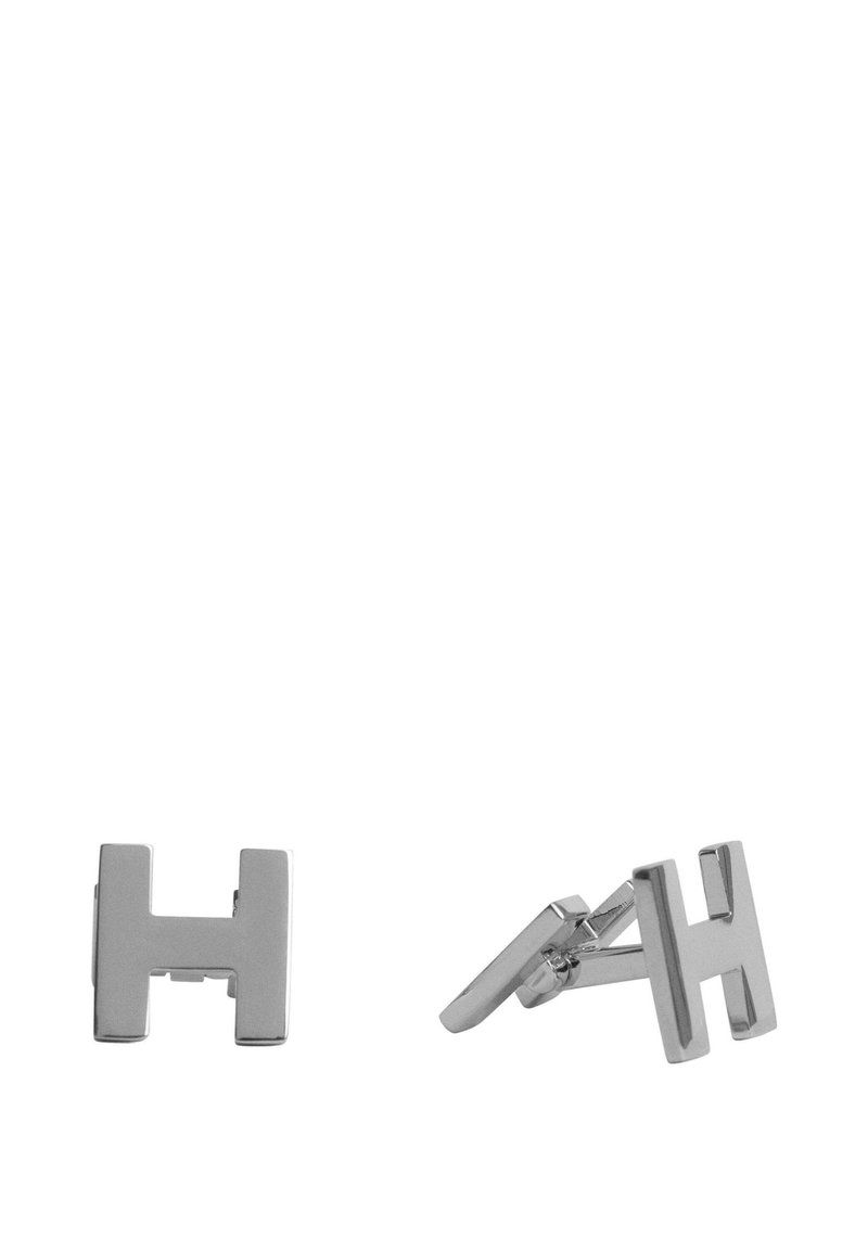 Gemelli in metallo argentato con un design geometrico a "H". Texture liscia e finitura lucida, dotati di chiusura a cerniera per un indossamento sicuro.
