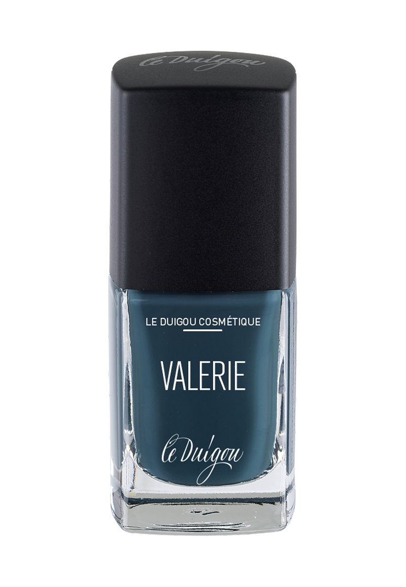 Nagellackflasche mit schwarzem quadratischem Deckel, klarem Glasboden, gefüllt mit tiefblauem Nagellack. Das Etikett zeigt weißen Text "VALERIE" und den Markennamen.