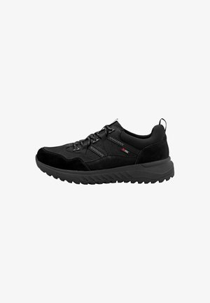 Chaussure de sport noire avec un mélange de matériaux lisses et texturés, embout renforcé et semelle en caoutchouc épaisse et ondulée pour une meilleure adhérence.