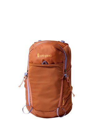Rust-colored Cotopaxi Eloiza backpack with front zipper pocket, light purple zipper accents, and logo on top center.