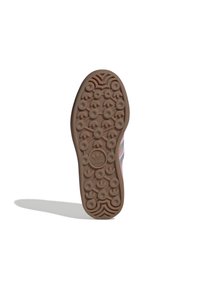 Καφετί καουτσούκ σόλα παπουτσιού με κυκλικές λαβές και ανάγλυφη υφή. Διαθέτει λογότυπο στο κέντρο και άκρες με κυματιστό σχέδιο.